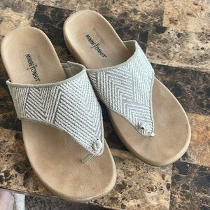 Minnetonka slip on sandals.